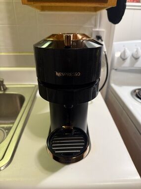 Nespresso Espresso Machine in Black with Gold Accents